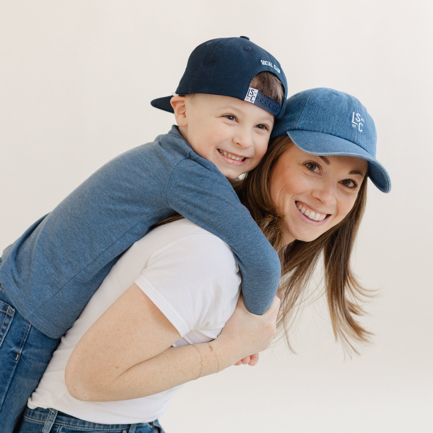 Adult wearing The Denim Local washed denim snapback hat
